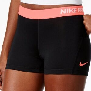 Nike Pro women’s 4” short DRI FIT black and light orange color size L EUC